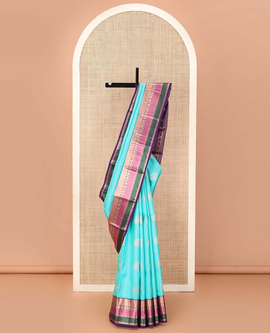 Blue yaanai buttas Vasundhara silk saree, contrast border of rekku, muthu, banaras, mayil kann, and rudraksham motifs, and jaal pallu