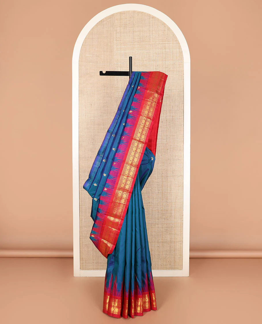 Blue zari buttas Kanchipuram silk saree, contrast thazampoo rekku border of salngai, neli, and rudraksham designs, and zari design pallu