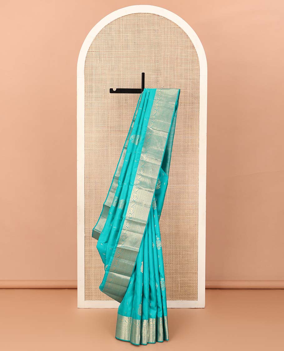 Blue zari buttas Vasundhara silk saree, zari border and pallu steeped with rekku, mayil, rudraksham, manga, kathir, cross neli and laddu kamalam