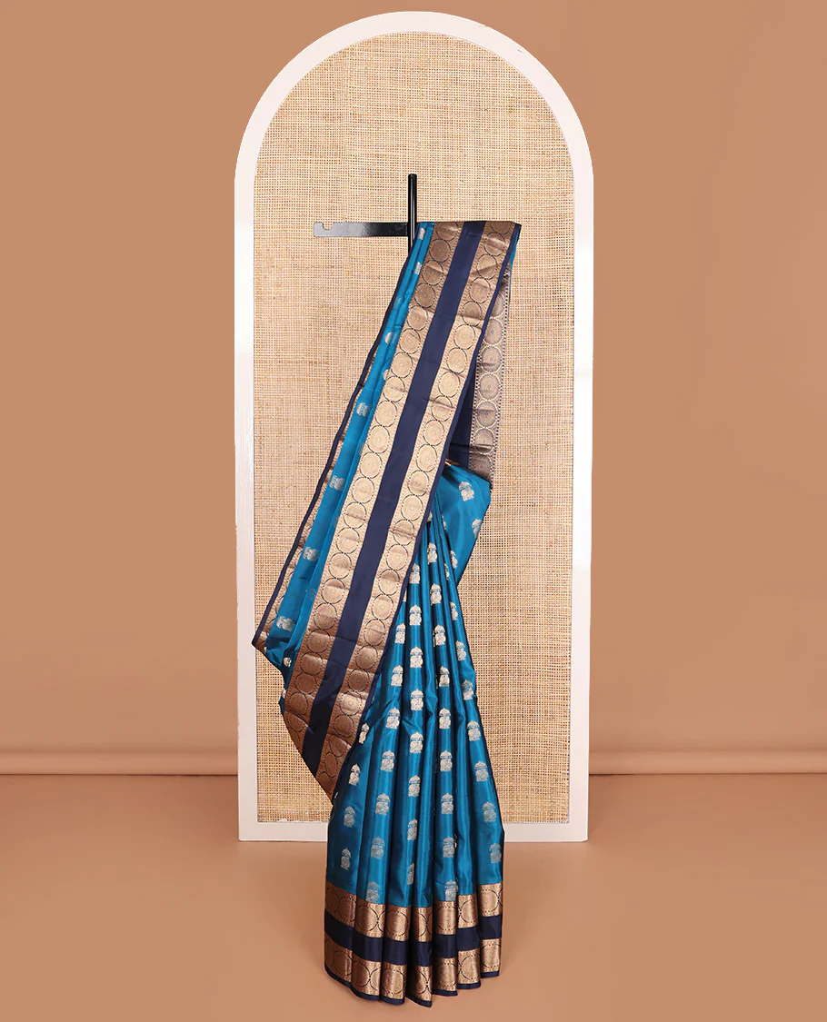 Blue zari buttas Vasundhara Lite Silk Mix Saree, contrast rettai pettu border of rekku, poun, and chakram motifs, and jaal pallu