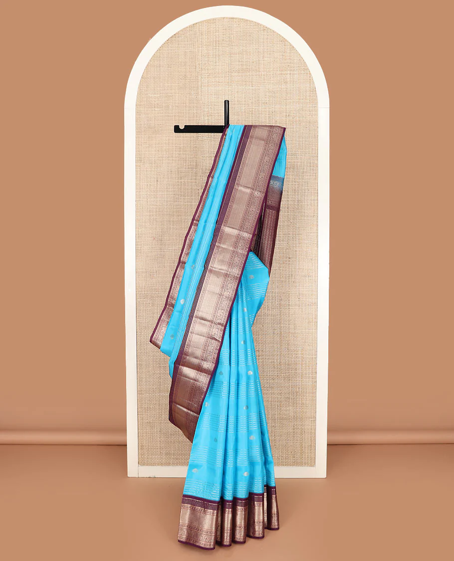 Blue zari design Vasundhara silk saree, contrast border of rekku, muthu, kathir, rudraksham, mayil kann, kuthirai, and yaanai designs, and geometric patterned pallu