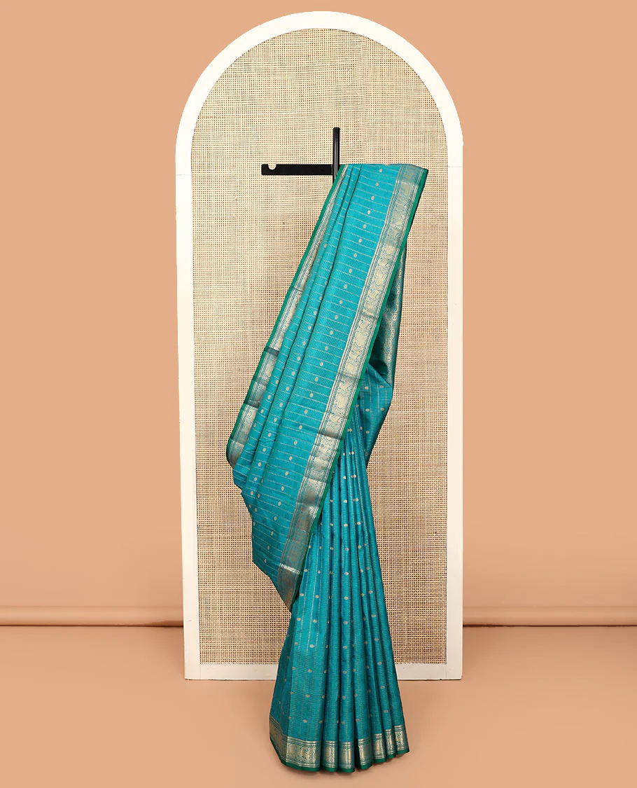 Blue zari design Vasundhara silk saree, zari border of banaras, kamalam, diamond, mayil and kuthirai designs, and chakram buttas steeped pallu