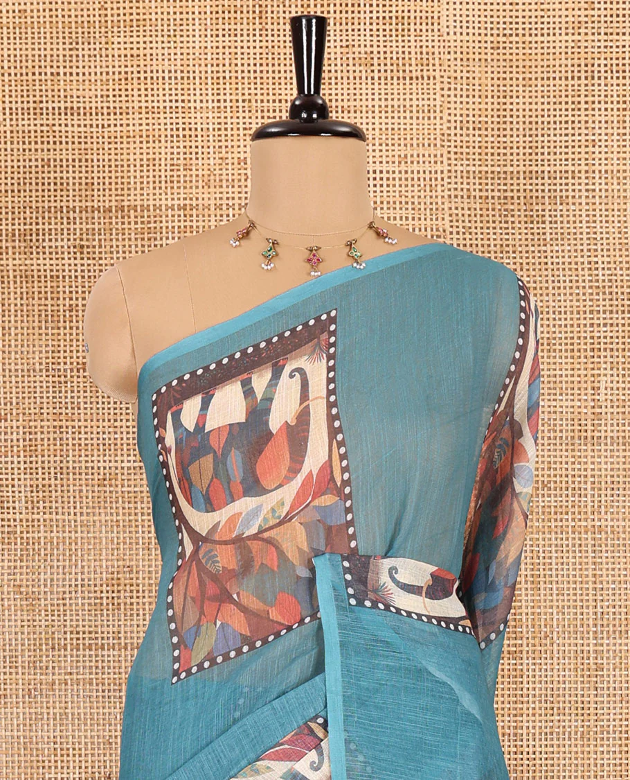 Blue plain linen cotton saree, mordern art style elephant motifs printed border, elephant printed pallu, and a leaf printed blouse - Image 3