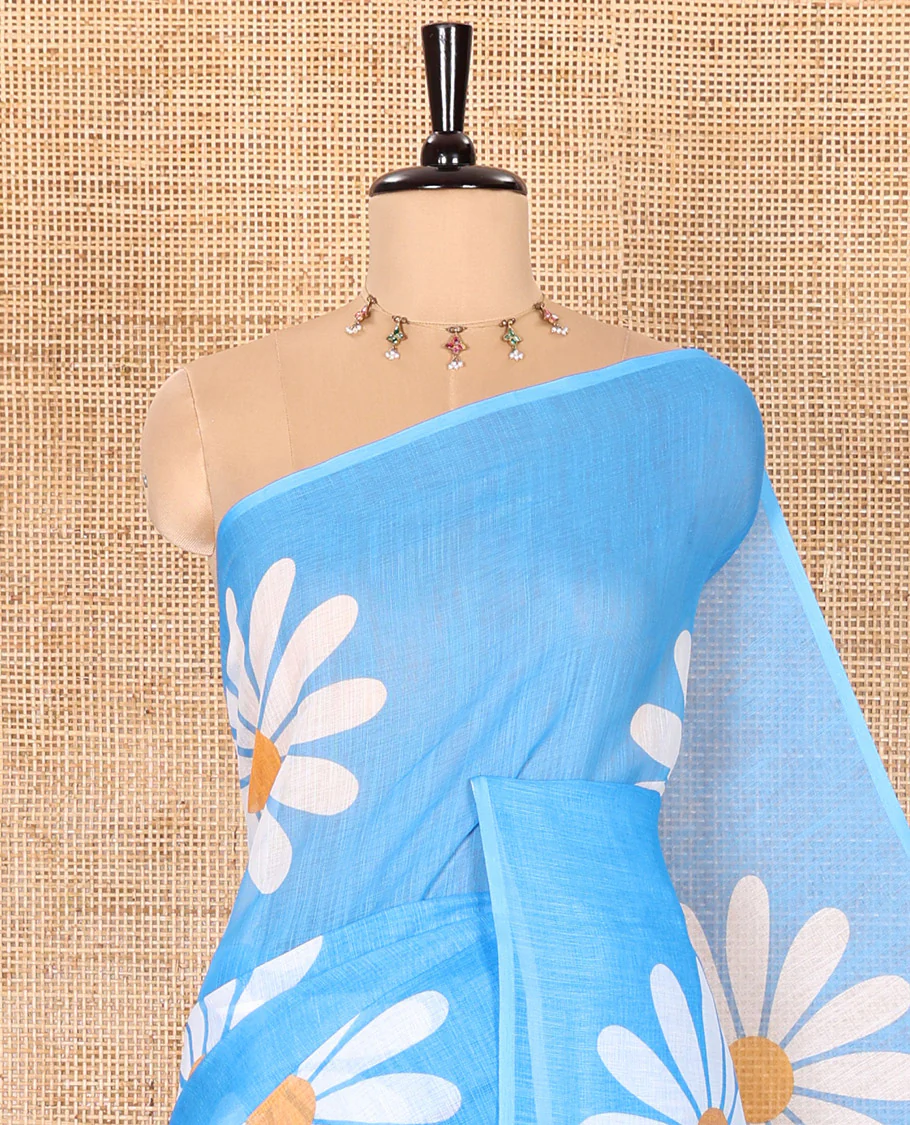 Borderless Blue Linen Saree Beautified with Big Daisy Flower Motifs Printed All Over the Body and Pallu, Complemented by a Contrast Blouse Printed with Daisy Flower Motifs - Image 2