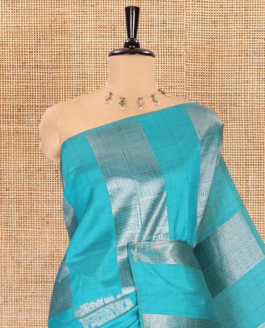 Borderless, blue striped, and zari traditional kanchi motifs fancy tussar saree, intricately zari-woven pallu, and a matching zari buttas woven blouse - Image 4