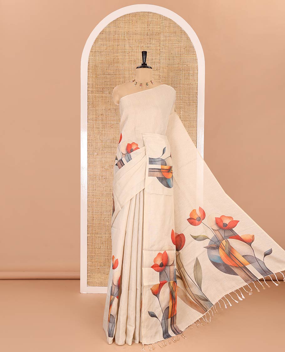Borderless cream floral printed tissue linen saree, floral printed pallu, and a floral motifs printed blouse