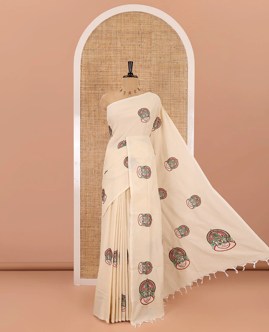Borderless cream kathakali motifs embroidered South cotton saree, kathakali motifs embroidered pallu, and a matching plain blouse