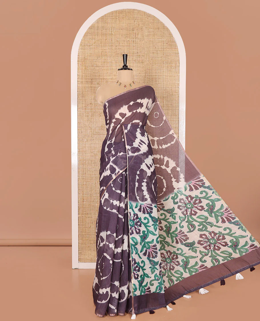 Borderless Dark Violet Linen Cotton Saree Bedecked with Shibori Prints, Complemented by Contrast Pallu Steeped with Floral Vine Print, and Paired with a Contrast Floral Printed Blouse