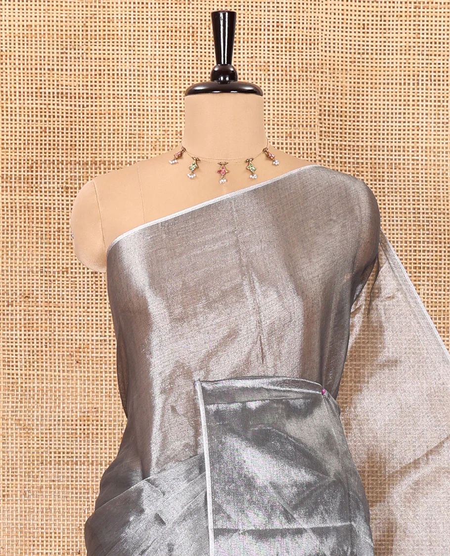 Borderless grey plain khadi tissue saree self pallu with tassels and a matching blouse - Image 2