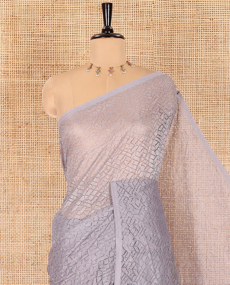 Borderless grey sparkling glittered russel net saree, self-pallu and a floral print with zig-zag embroidered blouse - Image 2