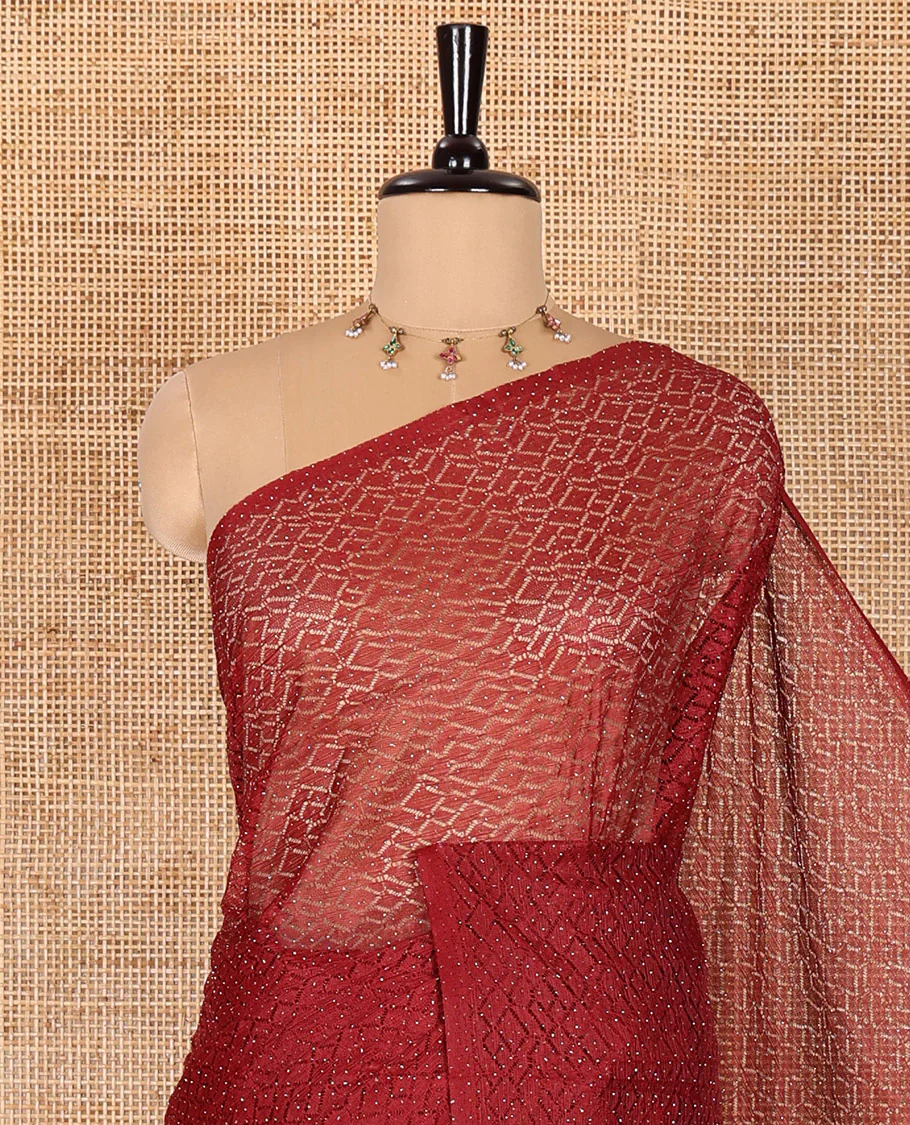 Borderless maroon sparkling glitter russel net saree with self-pallu, and a contrast floral printed and zig-zag patterned blouse - Image 2