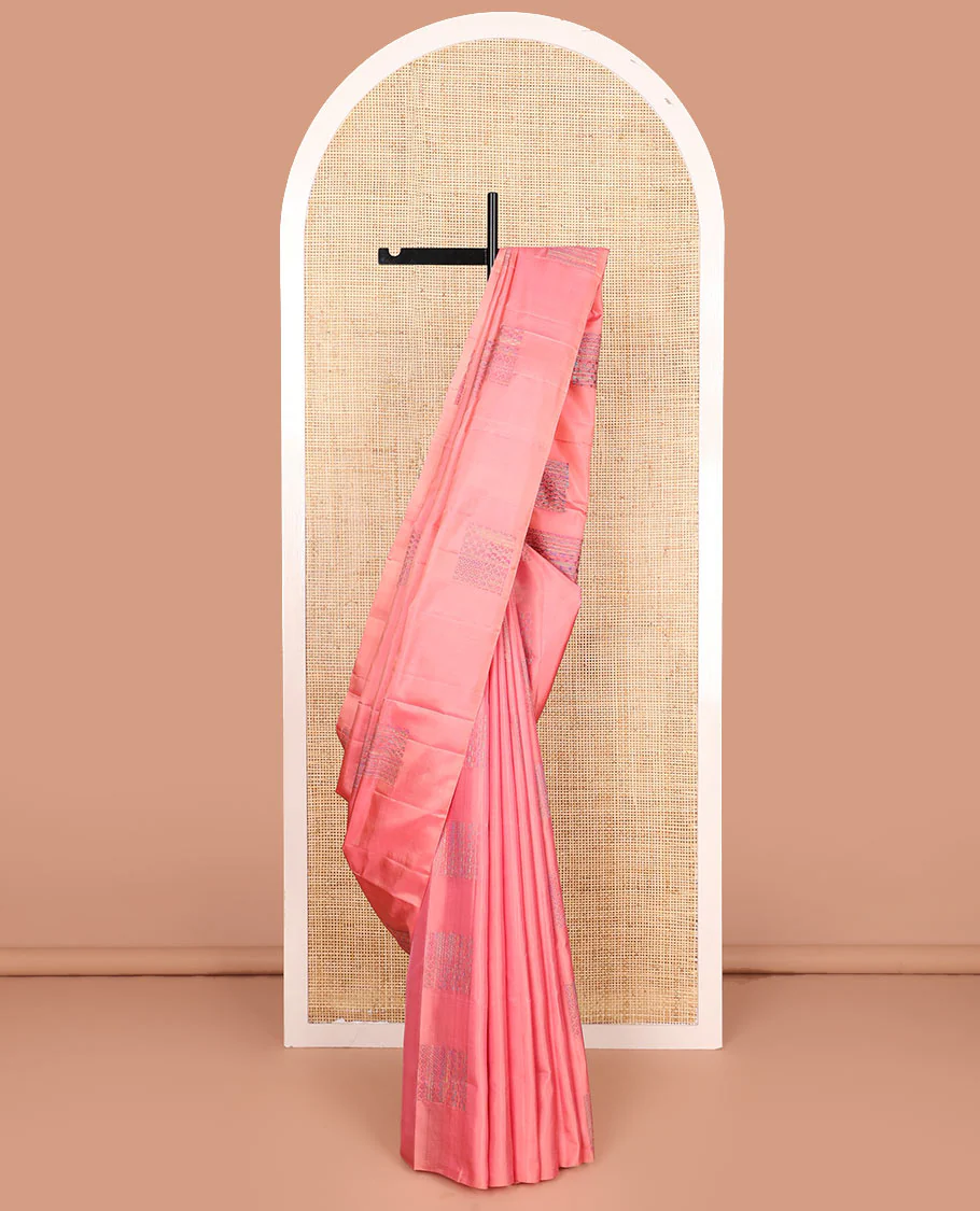 Borderless pink Mayuri soft silk saree features manga and rudraksham motifs, and self-pallu steeped with manga and rudraksham motifs