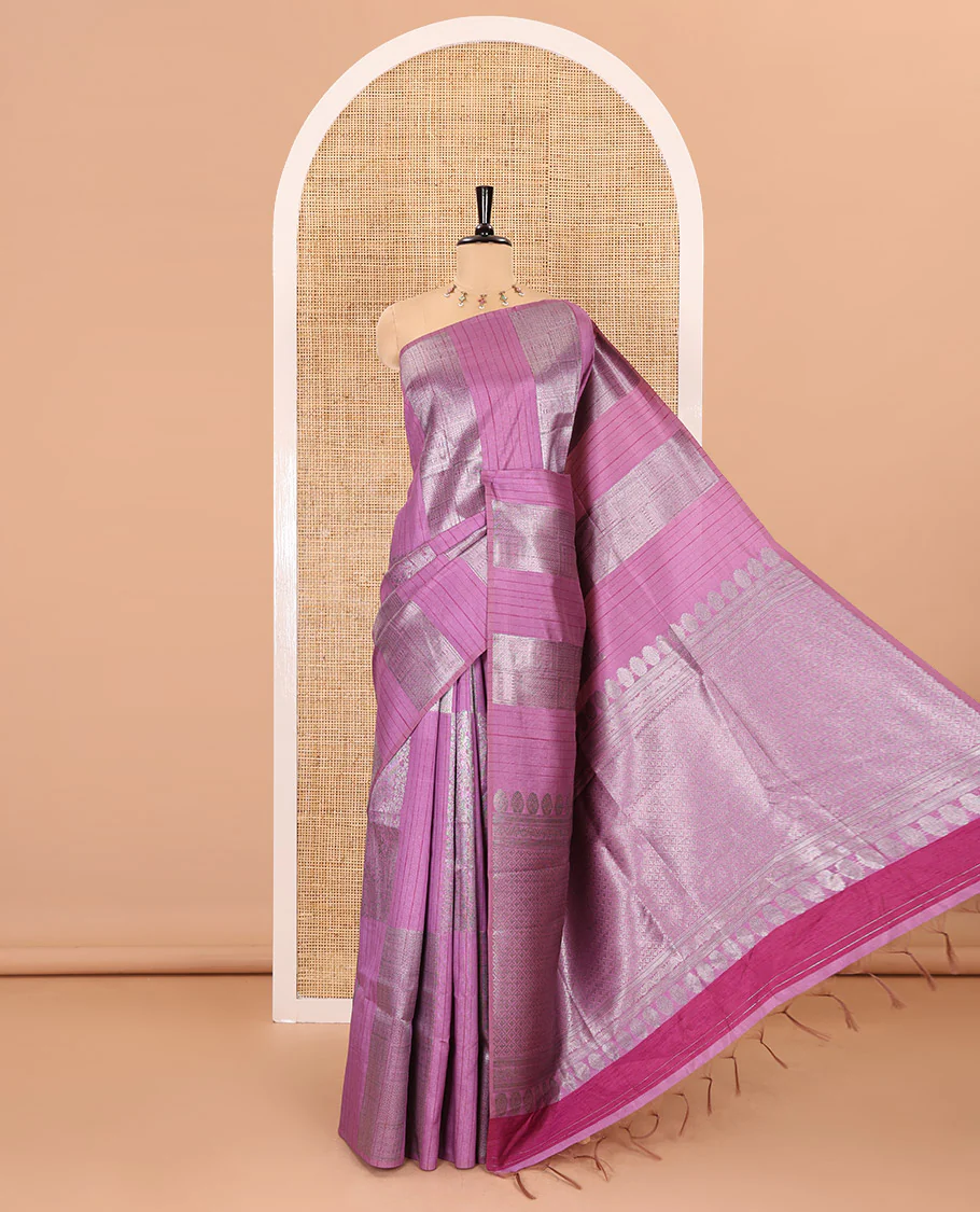 Borderless, pink striped, and zari traditional kanchi motifs fancy tussar saree, intricately zari-woven pallu, and a matching zari buttas woven blouse