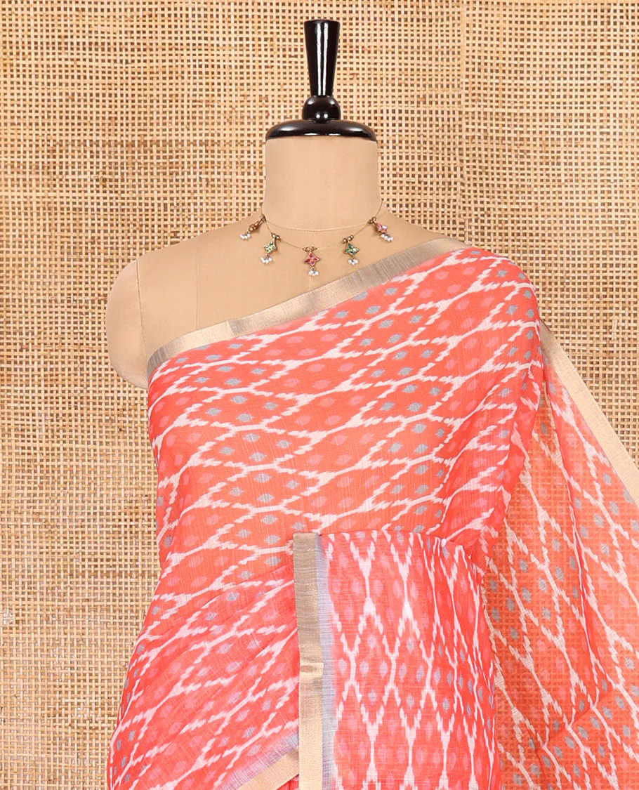 Borderless tomato pink ikkat jaal patterned linen cotton saree, contrast ikkat jaal patterned pallu and ikkat buttas blouse - Image 2