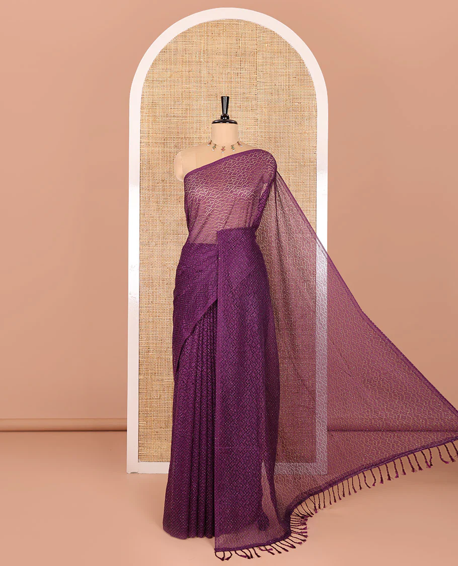 Borderless violet sparkling glitter russel net saree with self-pallu, and a contrast floral printed and zig-zag patterned blouse