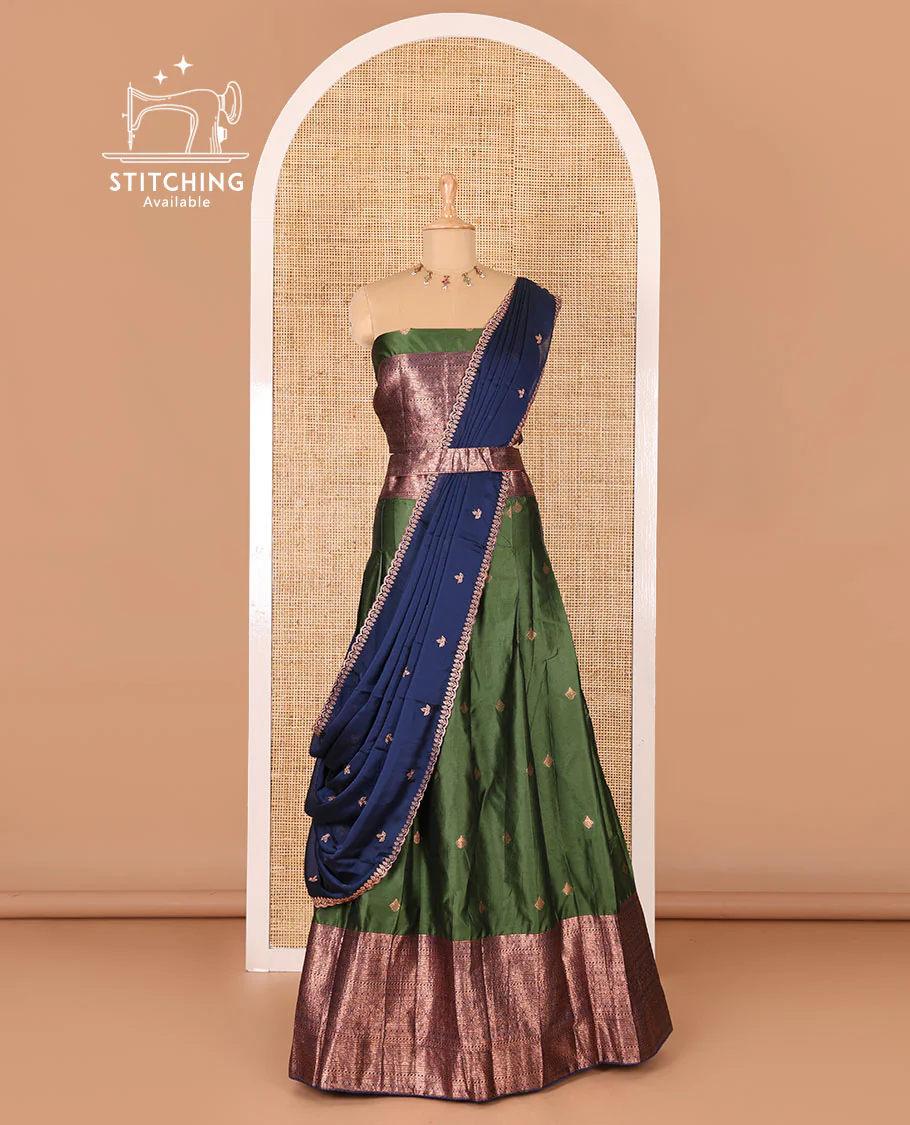 Bottle green taffeta silk half-saree, zari buttas and contrast traditional zari bordered skirt, a matching blouse, and contrast embroidered satin georgette  dhavani