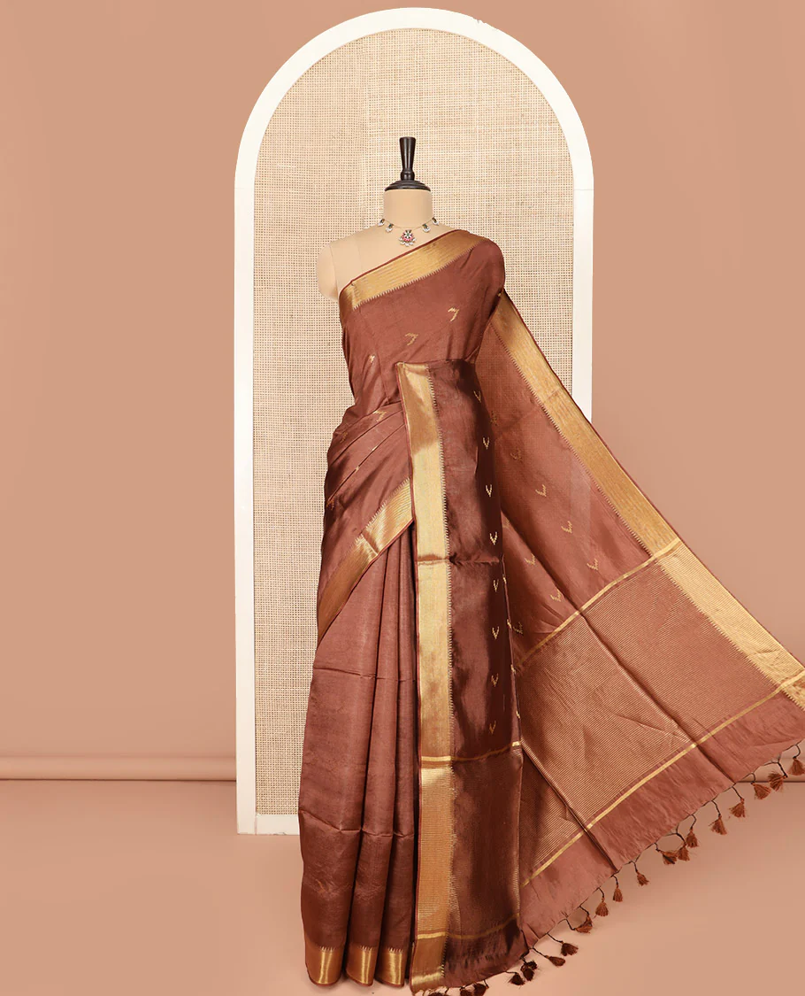 Brown Banana Pith Saree Decorated with Zari Temple Buttas, Delicately Woven Temple Zari Border, Gleaming Zari Pallu of Horizontal Stripes in Zari, and Paired with a Matching Plain Blouse