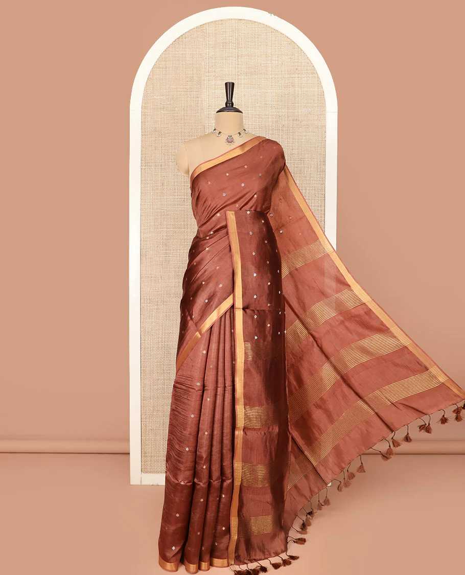 Brown Banana Pith Saree Highlighted with Zari Buttas, Subtly Woven Piping Border, Pallu of Zari Stripes, and Paired with a Matching Plain Blouse