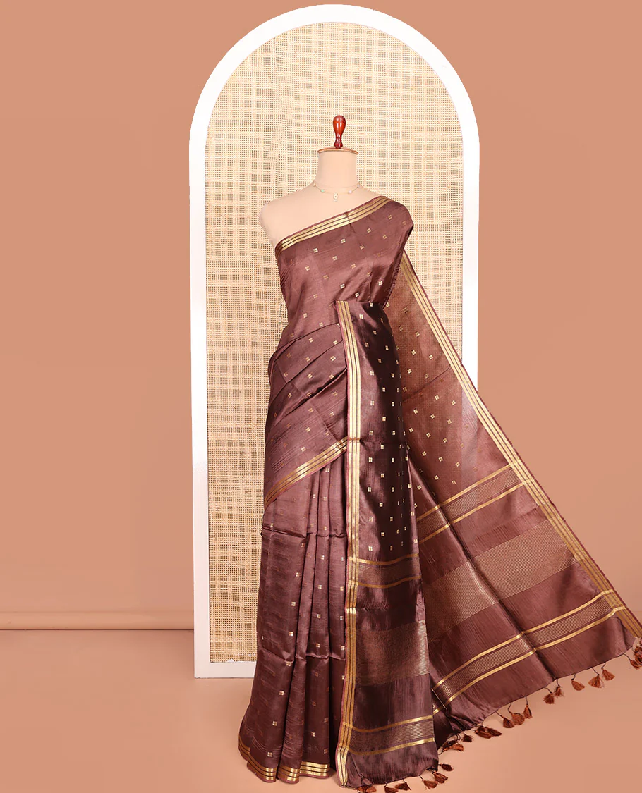 Brown Banana Pith Saree Mesmerized with Square-Shaped Zari Buttas, Subtly Woven Zari Piping Border, Pallu Gleamed Up with Zari Stripes, and Paired with a Matching Blouse