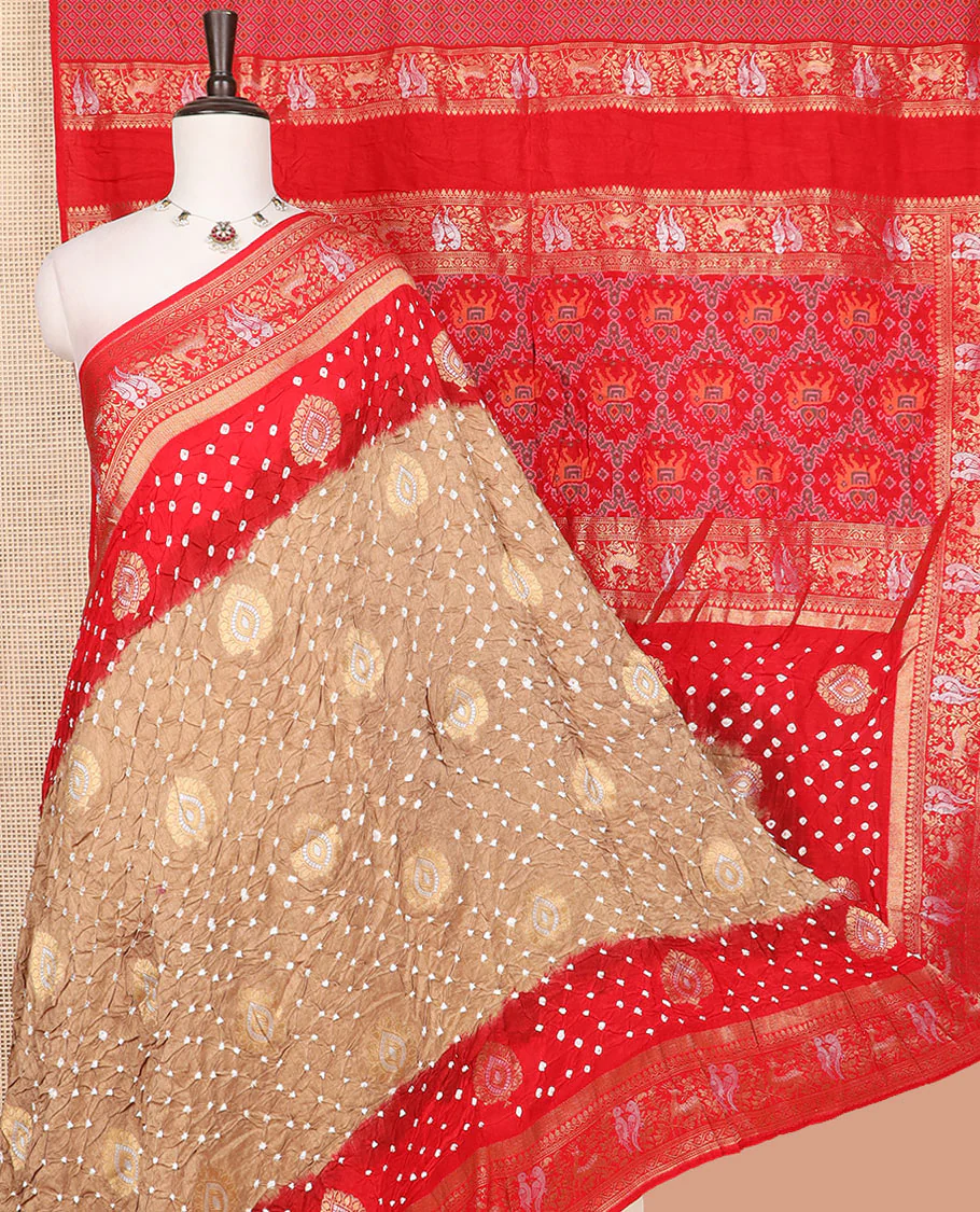 Brown bandhani dots and zari buttas bandhani silk saree, contrast flora-fauna motifs woven border, and patola elephant enclosed ogee patterned pallu