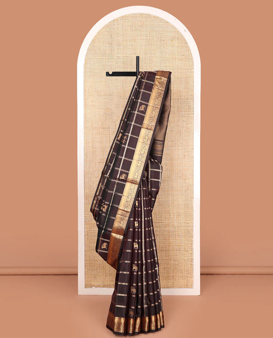 Brown maan and kuthirai butta enclosed checked Mayuri soft silk saree, zari border of thilakam, mayil kann, kuthirai, and kamalam designs, and jaal pallu