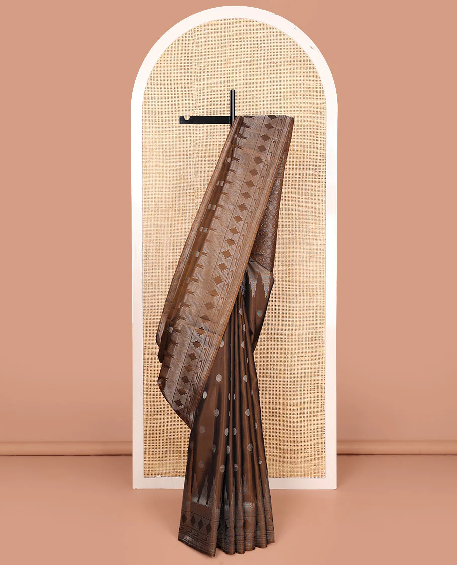 Brown rudraksham buttas Mayuri soft silk saree, temple geometric patterned border of muniya designs, and intricate pallu