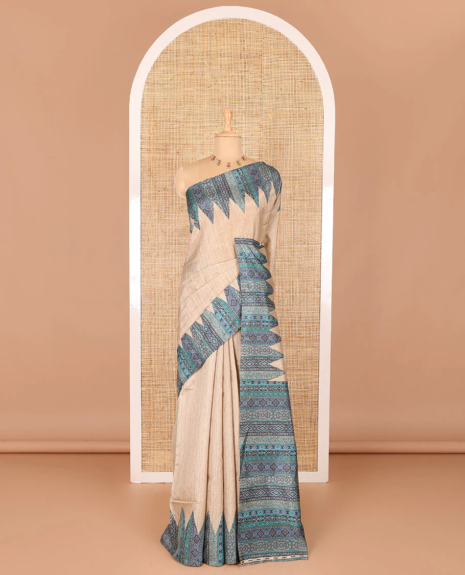 Chikku and blue plain Khicha Tussar saree, temple border of intricate Ajrakh print, Ajrakh printed pallu, and contrast Ajrakh printed blouse - Image 2