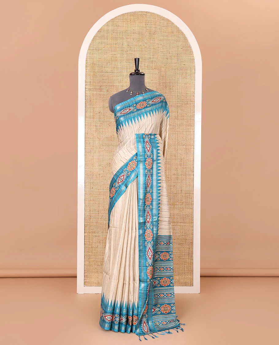 Chikku- blue plain Katan silk saree, contrast ikkat floral-geometric printed temple border, ikkat printed pallu, and ikkat printed blouse - Image 2