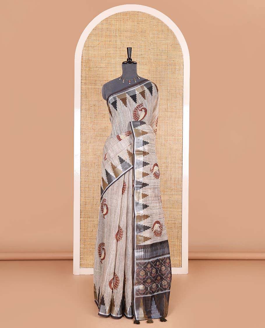 Chikku peacock motifs printed linen cotton saree, zari temple border, floral butta enclosed jaal printed pallu, and contrast buttas blouse - Image 2