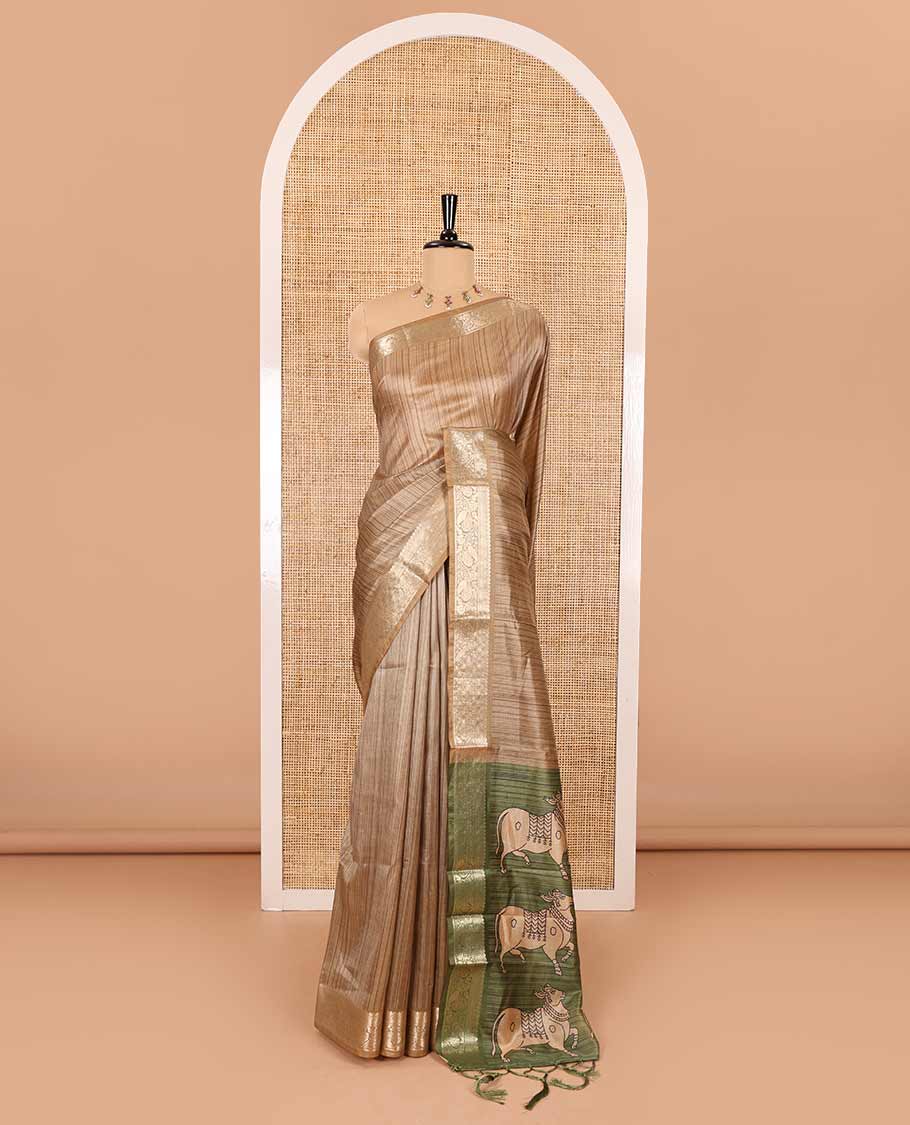 Chikku striped semi-tussar saree, traditional zari border of floral creeper designs, contrast pallu of Pichwai cow print, and contrast Pichwai cow printed blouse - Image 2