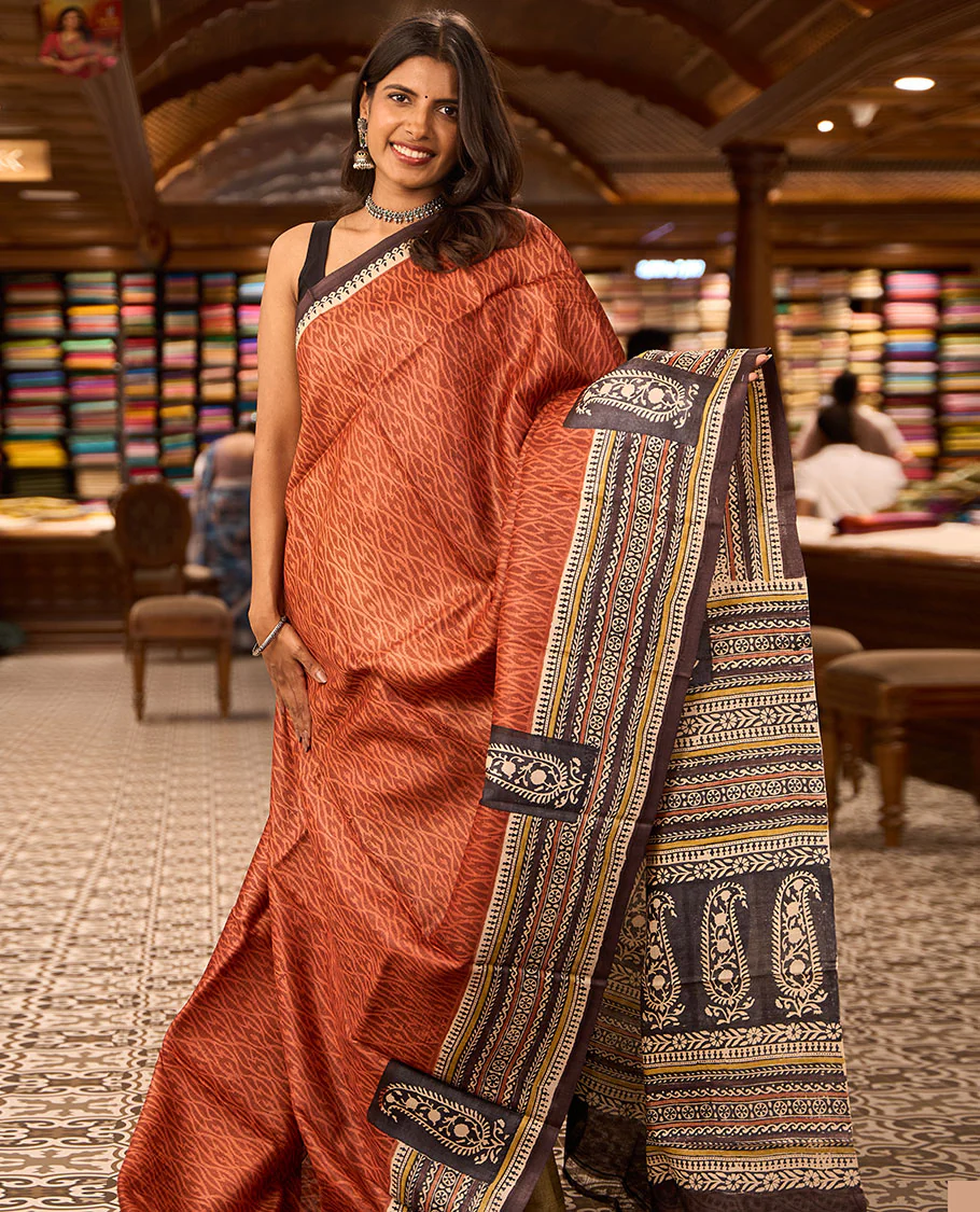 Maroon ogee design tussar saree with contrast floral design border & block floral print design pallu