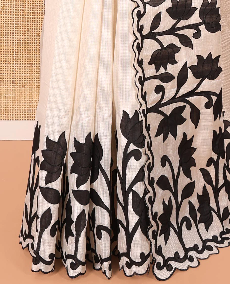 Cream and Black Plain Fancy Kota Silk Saree Sparsely Sparkled with Lotus Floral Applique Embroidered Scallop Border, Lotus Motifs Applique Embroidered Pallu, and a Contrast Plain Blouse - Image 3
