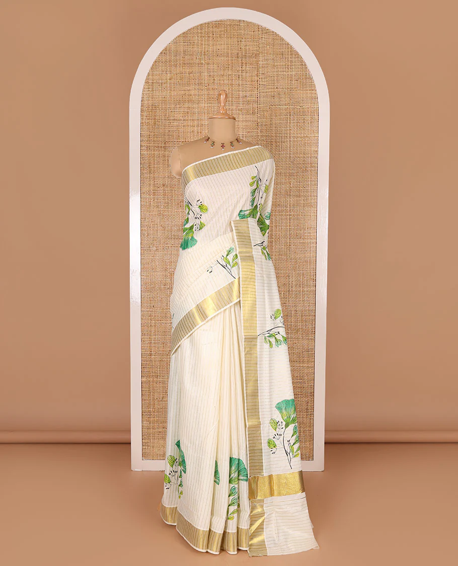Cream and green vertically striped with handblock floral motifs printed Kerala cotton saree, zari striped border, handblock floral printed pallu, and a matching blouse - Image 2