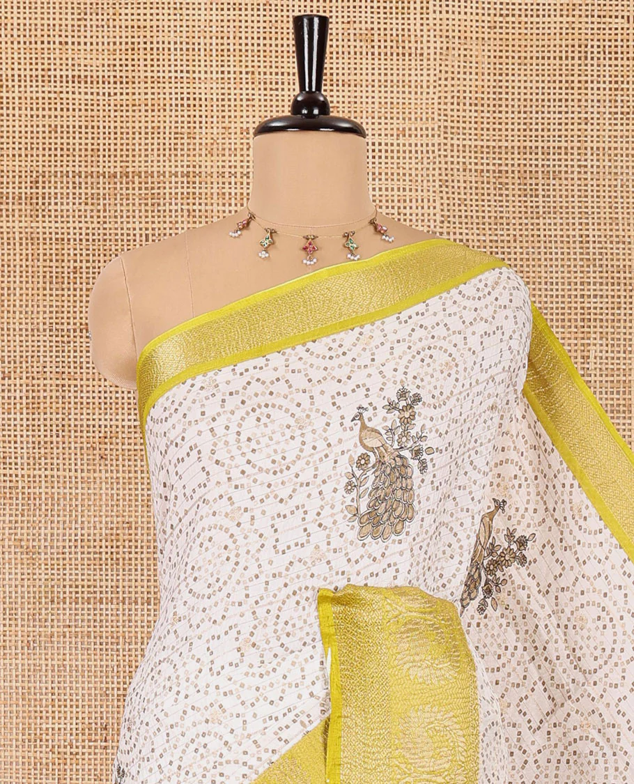 Cream and parrot green bandhani dots and peacock motifs printed dola crush saree, contrast zari peacock border, pallu of abstract peacock print, and a zari design blouse - Image 2