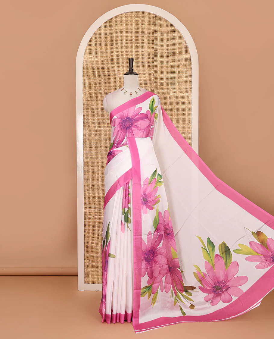 Cream base digital printed satin crepe saree with big baby pink floral motifs all over the saree, plain baby pink border & blouse