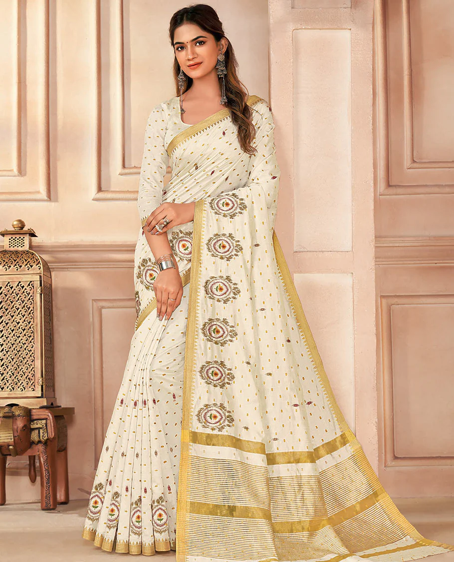 Cream buttas and embroidered designer saree, temple border, and pallu of stripes