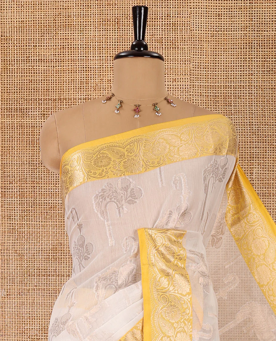 Cream floral motifs zari woven Chanderi cotton saree, contrast floral design zari border, jaal pallu, and a contrast jacquard blouse - Image 2