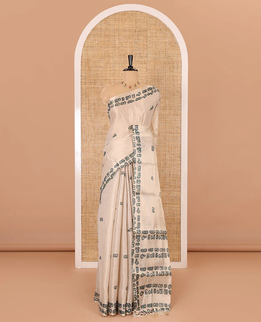 Cream-green Malayalam letter printed tissue saree, self-border and pallu steeped with Malayalam letter motifs, and a contrast plain blouse - Image 2
