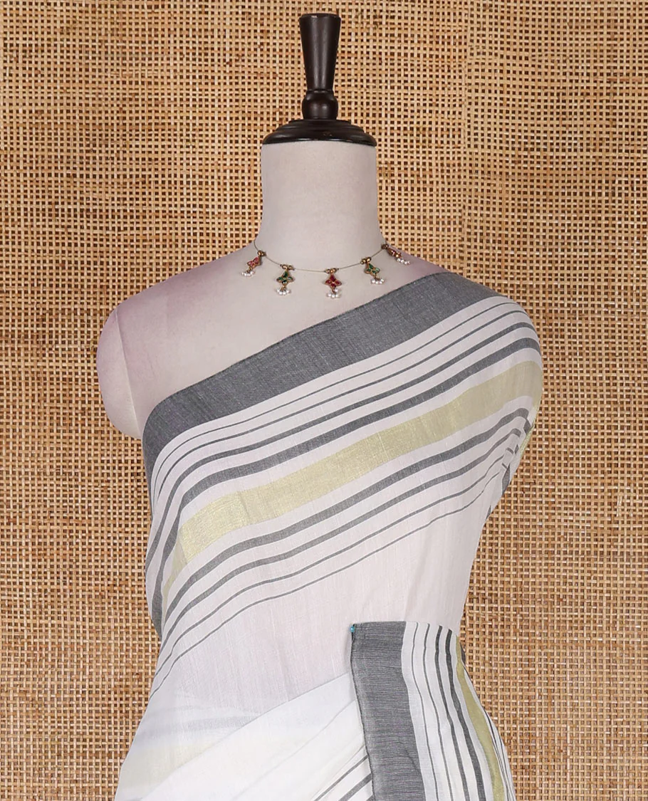 Cream-grey plain design mul mul cotton saree, contrast gold zari horizontally striped border, plain pallu, and plain blouse - Image 3