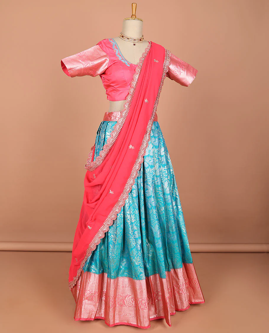 Blue floral jacquard semi-stitched half saree with contrast zari border, embroidered blouse & scallop border dhavani