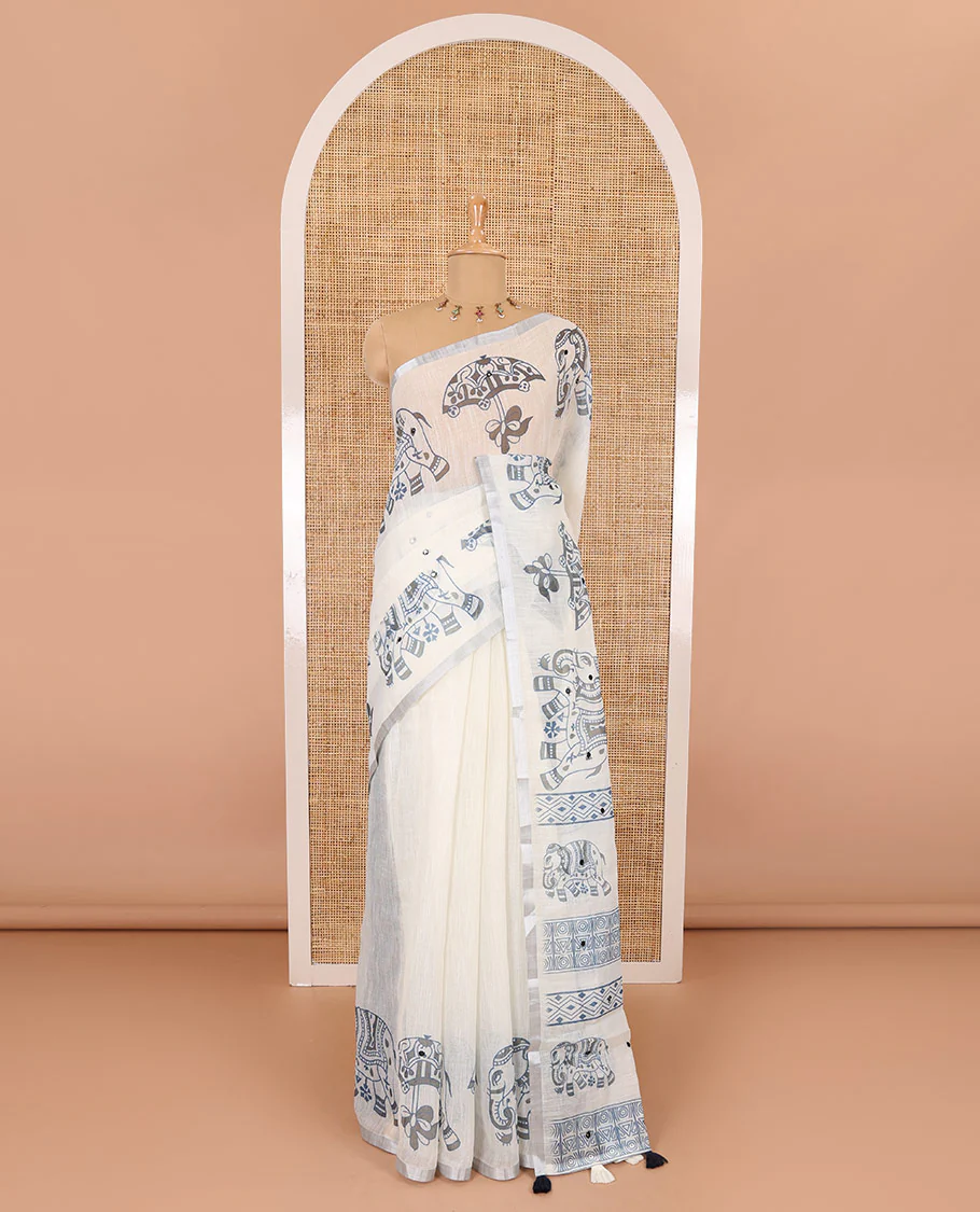 Cream mirror work linen cotton saree, zari border of umbrella and elephant motifs print, pallu of print and mirrorwork, and a contrast printed blouse - Image 2