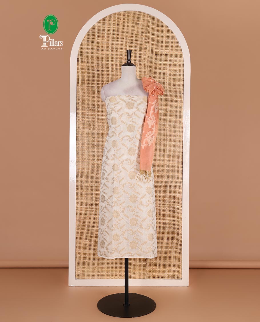 Cream with peach semi-chanderi material churidar set, floral jaal jacquard top, contrast taffeta silk bottom, and jamdani style dupatta