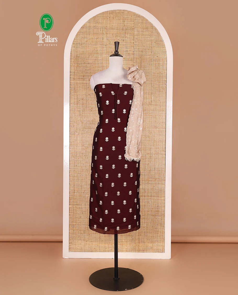 Dark brown Vichitra silk material churidar set, floral motifs embroidered top, contrast Santoon bottom, and floral vine thread embroidered scallop dupatta