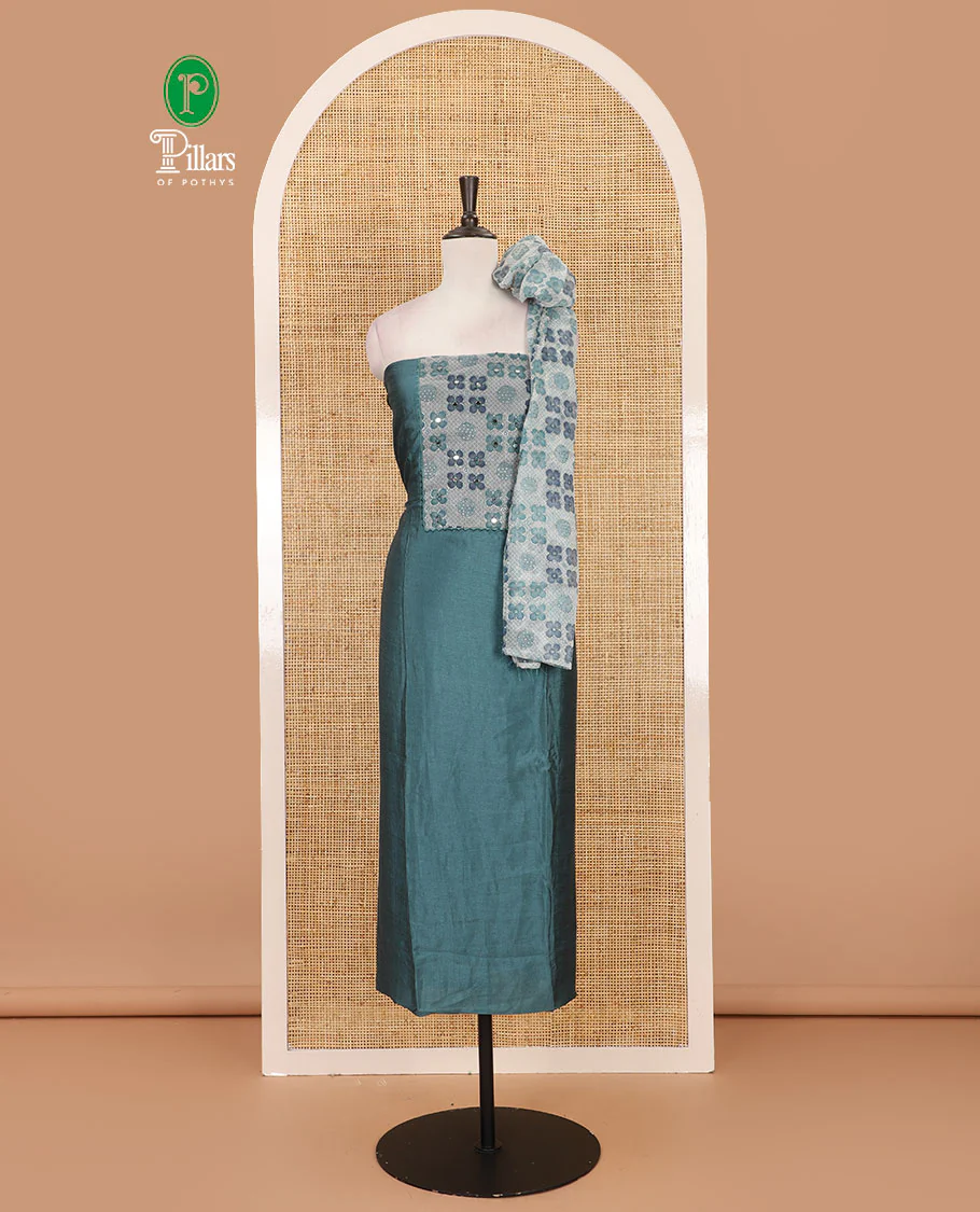 Dusky green Vichitra silk material chudidar set, brasso print & mirror embroidered neck work top, santoon bottom & four-petal floral motifs printed dupatta