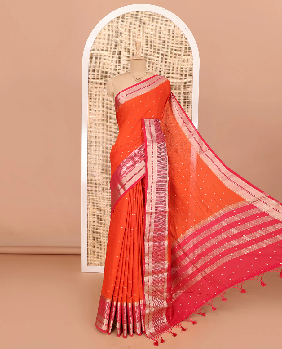 Fanta Orange Assam Silk Saree Adorned with All-Over Buttas, Featuring a Contrast Temple Border of Butta Enclosed Checked Design, a Pallu Steeped with Zari Stripes, and Paired with a Contrast Zari Design Blouse