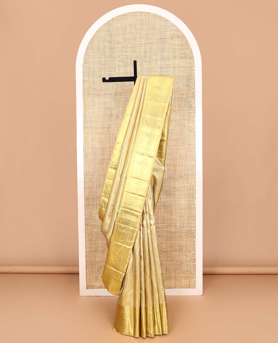 Gold jacquard Samudrika silk saree, zari border of thilakam mokku, banaras, muthu, diamond, and kodi visiry designs, and jaal pallu