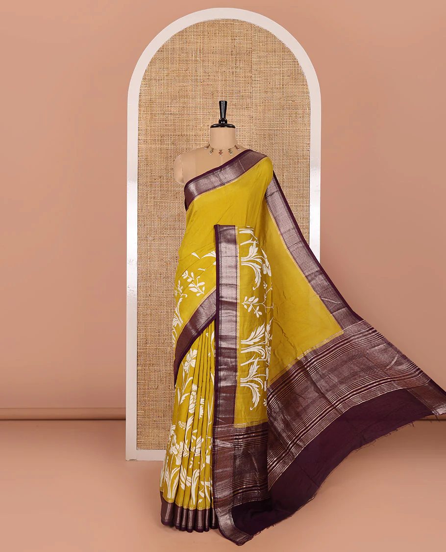 Gold leaf vine discharge printed assam silk saree, contrast chevron design zari border, zari stripes, and a contrast zari bordered blouse