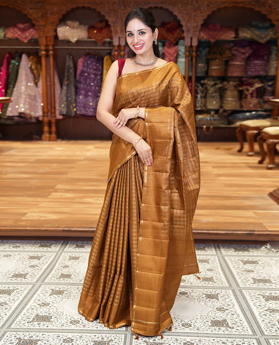 Golden brown zari checked fancy tussar silk saree, zari striped border, plain pallu, and a matching blouse