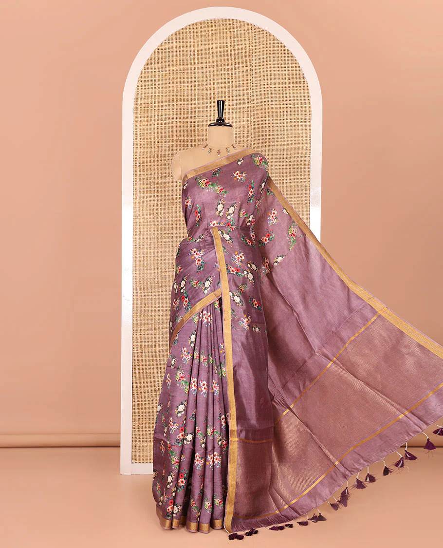 Grape-color colorful floral bunches printed banana pith saree, piping zari border, striped pallu, and a printed blouse