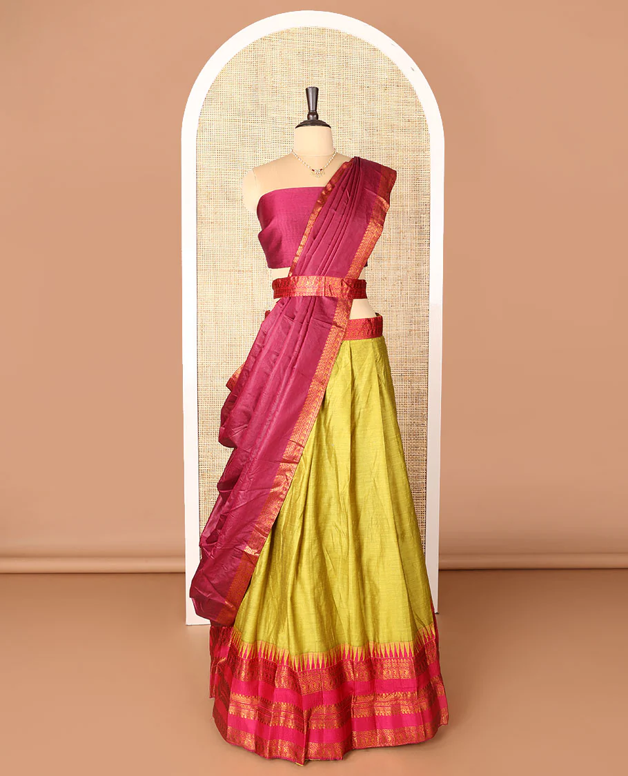 Green art-silk half-saree, plain with contrast temple traditional design bordered skirt, contrast blouse, and plain zari bordered dhavani